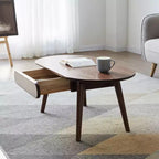 Tavolino ovale Belle in legno massello di rovere da 100 cm di larghezza con un cassetto