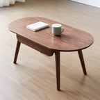 Tavolino ovale Belle in legno massello di rovere da 100 cm di larghezza con un cassetto